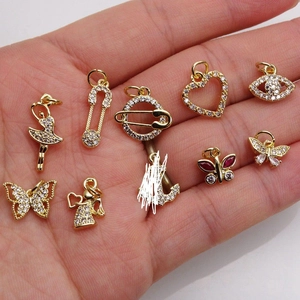 Golden mini charms collection featuring butterfly heart and angel with zircon inlays
