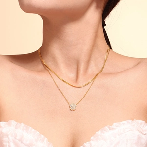 Double-layered gold necklace set with snake chain and zircon clover pendant for women