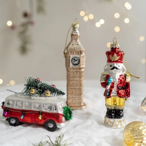 Christmas glass ornaments set including red bus, Big Ben tower and nutcracker soldier