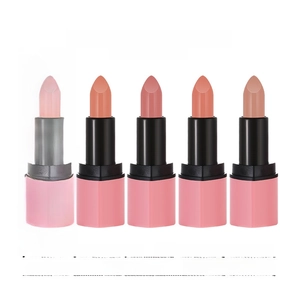 Detail view of four matte heart lipsticks in nude and pink shades with branded packaging