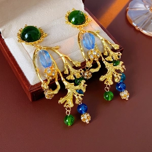 Vintage gold branch earrings with green resin cabochon and blue crystal tassels