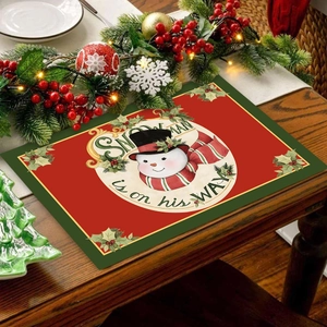 Christmas snowman placemat in red and green festive dining table decoration for holiday party