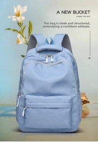 Close-up of light blue waterproof nylon backpack with front pocket and breathable straps