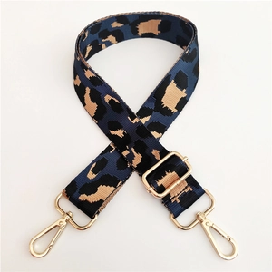 Detail of adjustable nylon leopard print strap with premium gold metal lobster clasps