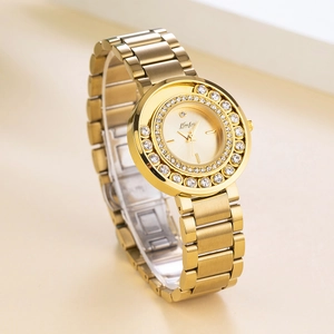 Luxurious gold-tone women's watch with crystal-encrusted bezel and stainless steel band