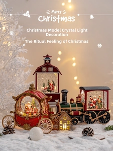 Close-up of lighted Christmas crystal lamps with Santa Claus and winter scene inside