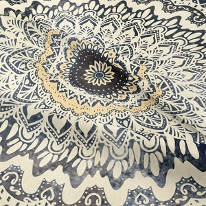 Bohemian mandala tapestry in navy and yellow with soft woven fabric texture