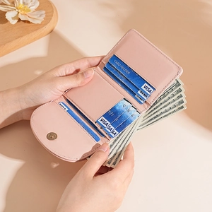 Pink trifold wallet for women with multiple card slots and spacious storage design