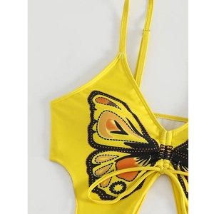 Detail of yellow bikini top featuring realistic butterfly print and drawstring front knot