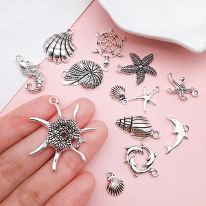 Antique silver marine alloy pendants set featuring starfish, seahorse and sea turtle shapes