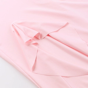 Close-up detail of soft pink ruffle fabric with smooth texture for a sexy V-neck maxi dress