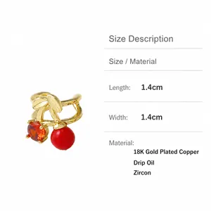 Macro shot showing 1.4cm dimensions of 18K gold plated cherry ear cuff with red zircon