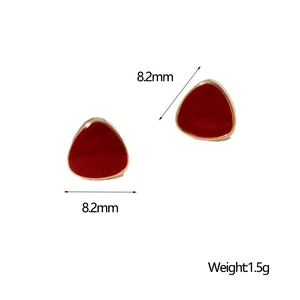 Macro shot of 8.2mm red triangle stud earrings with 18K gold plated metal edges