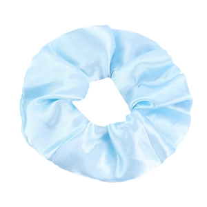 Detailed view of light blue satin scrunchie with silky texture and soft fabric folds