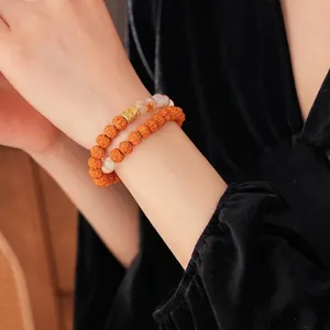 Double-layer amber Bodhi seed bead bracelet with gold metal tube and white jade accents