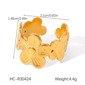 Detail view of a floral pattern gold ring showing dimensions of 1.48cm height and 2.1cm width
