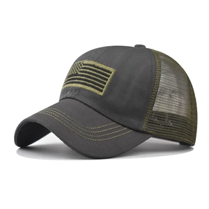 Detail of tactical mesh trucker hat with embroidered American flag and reinforced stitching