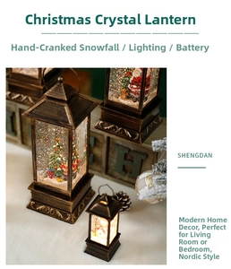 Close-up of vintage bronze Christmas lantern with LED light and swirling snow effect