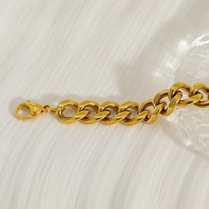 Close-up of 18k gold-plated stainless steel chunky Cuban chain bracelet with lobster clasp