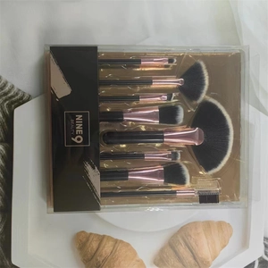 8-piece black and rose gold makeup brush set in transparent box with NINE 9 BEAUTY logo
