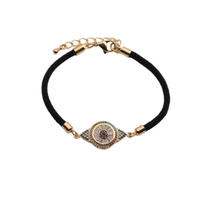 Detail of adjustable evil eye woven bracelet with blue zircon and gold lobster clasp