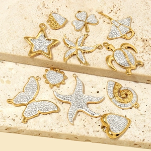 Golden titanium steel pendants featuring butterfly, starfish and heart shapes with cubic zirconia