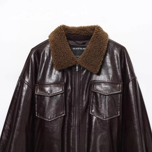 Women's vintage dark brown leather jacket with faux fur collar and waist belt