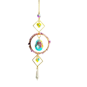 Golden suncatcher ornament featuring purple natural crushed stones and crystal heart pendants