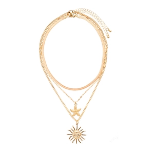Three-layer gold necklace set with starfish and sun face pendants on a flat snake chain