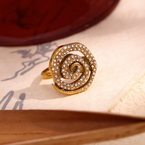 Detail of 18K gold-plated spiral ring featuring rows of shimmering white pavé rhinestones