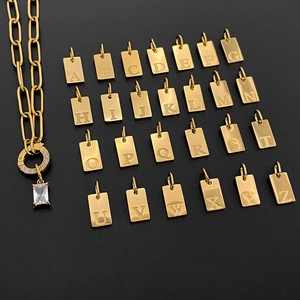 Detailed view of 26 gold-plated initial letter pendants for DIY jewelry