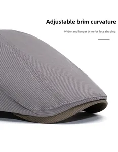 Detail view of foldable striped flat cap brim with reinforced stitching for face shaping