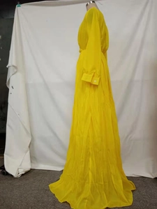 Detail view of the pleated waist design on a deep V-neck yellow maxi dress on a mannequin