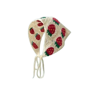 Cream crochet triangle bandana with strawberry pattern and tie-up strap on white background