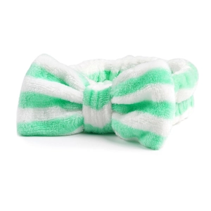 Detail van zachte groen-wit gestreepte pluche hoofdband met een grote decoratieve strik