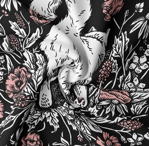 Close-up detail of soft black cat tapestry fabric showing floral print and texture