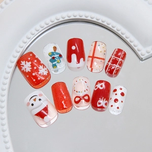 Christmas snowman and snowflake themed hand-painted press-on nail set in red and white