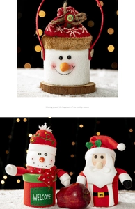 Close-up of Snowman and Santa gift baskets with red apple and festive decor