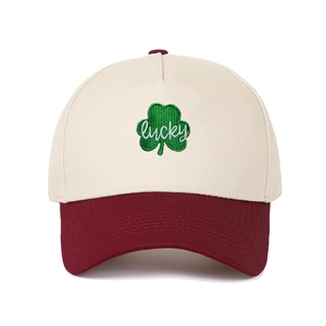 Detail of leaf clover embroidery with lucky script on a color-block trucker cap
