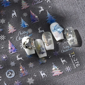 Holographic Christmas nail art stickers with reindeer and snowflake designs for DIY manicure