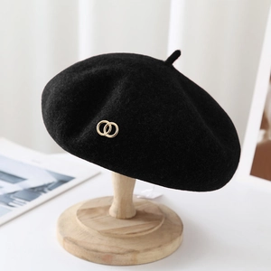 Elegant black wool beret hat for women with a decorative golden double ring metal buckle