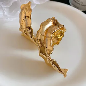 Artistic golden irregular leaf open arm cuff bracelet with polished lava texture
