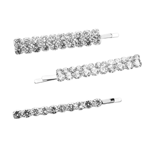 Three sparkling silver metal hair clips with rhinestones on a white background