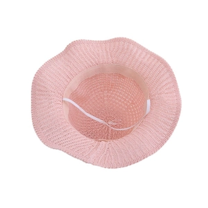 Stylish pink woven straw sun hat for girls with wavy brim and elastic chin strap