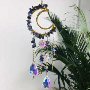 Detail of moon-shaped suncatcher with blue amethyst chips and clear crystal prisms