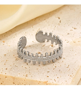 Detailed close-up of a silver fishbone ring with a beaded band and adjustable open design