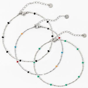 Three silver stainless steel anklets with colorful beads and lobster clasp on white background