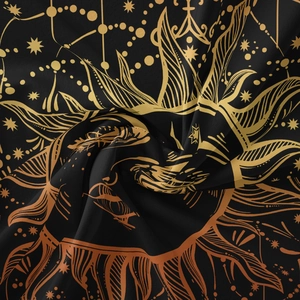 Close-up of bohemian sun tapestry fabric with golden embroidery and silky texture
