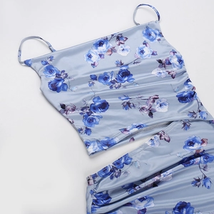 Detailed view of blue floral satin fabric on sleeveless top and long skirt set