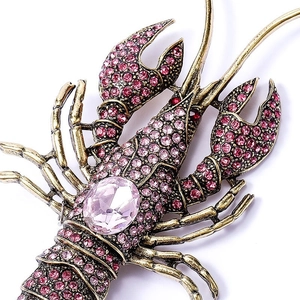 Pink rhinestone lobster brooch in vintage gold metal finish with large faceted gemstone